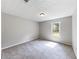 Bedroom with neutral paint, carpet, and a window offering natural light at 30 Court S, Ellenwood, GA 30294