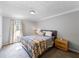 Bedroom featuring a bed with bedside tables and soft, neutral carpeting at 30 Court S, Ellenwood, GA 30294