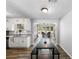 Eat-in kitchen dining nook area with wooden floors and natural light at 30 Court S, Ellenwood, GA 30294