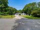 Traditional home with large front yard and concrete driveway at 30 Court S, Ellenwood, GA 30294