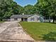 Beautiful home with a well-kept lawn and long driveway at 30 Court S, Ellenwood, GA 30294