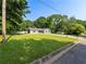 Well-manicured lawn and landscaping highlight this charming home, set back from the road at 30 Court S, Ellenwood, GA 30294