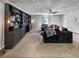 Large living room featuring custom built-ins, plush sofa, and ample natural light at 30 Court S, Ellenwood, GA 30294