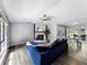 Open-concept living area with a fireplace, hardwood floors, and views into the breakfast nook at 30 Court S, Ellenwood, GA 30294
