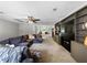 Cozy living room with large couch, custom shelving, and a ceiling fan at 30 Court S, Ellenwood, GA 30294