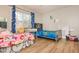 Charming ' bedroom with playful decor, wood floors, and plenty of space for activities and imagination at 365 Winding River Dr # E, Atlanta, GA 30350