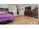 This comfortable bedroom features wood floors, a large dresser, and a well-lit atmosphere for relaxation at 365 Winding River Dr # E, Atlanta, GA 30350