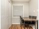 Cozy dining area with wooden floors, a marble table and ample natural light from a window at 365 Winding River Dr # E, Atlanta, GA 30350