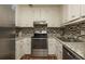 Well-equipped kitchen with stainless steel appliances and ample countertop space for cooking convenience at 365 Winding River Dr # E, Atlanta, GA 30350