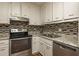 Modern kitchen featuring sleek stainless steel appliances and plentiful counter space for meal prep at 365 Winding River Dr # E, Atlanta, GA 30350