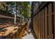 Narrow side yard with a wooden fence and mature trees at 365 Winding River Dr # E, Atlanta, GA 30350