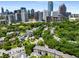 Stunning aerial view showcasing the lush greenery and upscale homes of the neighborhood and skyline at 124 Lafayette Ne Dr # 4, Atlanta, GA 30309