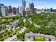 Aerial view of the property with city skyline in the background and lush greenery at 124 Lafayette Ne Dr # 4, Atlanta, GA 30309