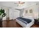 Bedroom featuring hardwood floors, matching wardrobe cabinets, and a ceiling fan at 124 Lafayette Ne Dr # 4, Atlanta, GA 30309