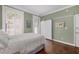 Bedroom featuring hardwood floors, closet and shuttered windows at 124 Lafayette Ne Dr # 4, Atlanta, GA 30309