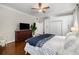 Cozy bedroom featuring hardwood floors, large wardrobe cabinets, and a ceiling fan at 124 Lafayette Ne Dr # 4, Atlanta, GA 30309