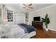 Comfortable bedroom featuring hardwood floors, built-in shelving and ceiling fan at 124 Lafayette Ne Dr # 4, Atlanta, GA 30309
