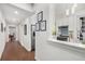 Hallway leading into kitchen area that features white walls, wood floors, and a marble counter at 124 Lafayette Ne Dr # 4, Atlanta, GA 30309