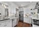 Bright kitchen with white cabinets, stainless steel appliances, backsplash, and eat-in counter at 124 Lafayette Ne Dr # 4, Atlanta, GA 30309