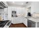 Well-lit kitchen featuring white cabinets, stainless steel appliances, and a tile backsplash at 124 Lafayette Ne Dr # 4, Atlanta, GA 30309