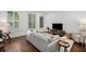 Bright living room features wood floors, a comfortable gray sofa and natural light at 124 Lafayette Ne Dr # 4, Atlanta, GA 30309