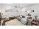 Bright living room features wood floors, a comfortable gray sofa, and sophisticated decor at 124 Lafayette Ne Dr # 4, Atlanta, GA 30309