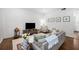 Bright living room features wood floors, a comfortable gray sofa and decor at 124 Lafayette Ne Dr # 4, Atlanta, GA 30309