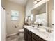 Bathroom featuring a double sink vanity, a toilet, and tiled floor at 1650 Walking Horse Trl, Cumming, GA 30041