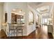 Arched openings define the transitions from the kitchen to the dining and living spaces, highlighting the home's design at 1650 Walking Horse Trl, Cumming, GA 30041