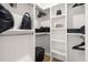 Spacious closet with built-in shelving and hanging rods, providing ample storage space at 230 New St # 2201-4, Decatur, GA 30030
