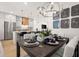 Stylish dining area open to kitchen featuring modern pendant lights and stainless appliances at 230 New St # 2201-4, Decatur, GA 30030
