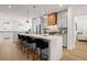 Bright kitchen features stainless appliances, a large island with seating, and hardwood flooring at 230 New St # 2201-4, Decatur, GA 30030