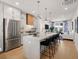 Beautiful modern kitchen with stainless steel appliances, marble island, and open floor plan at 230 New St # 2201-4, Decatur, GA 30030