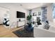 Stylish living room featuring modern decor, a comfortable sofa, and access to a balcony at 230 New St # 2201-4, Decatur, GA 30030