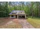 A charming new construction home with a two-car garage and unfinished yard at 48 Paschal St, Temple, GA 30179