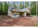 Charming new construction home with an unfinished yard and a two-car garage at 48 Paschal St, Temple, GA 30179