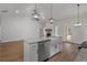 Open concept kitchen featuring granite countertops, stainless appliances, and bright lighting at 48 Paschal St, Temple, GA 30179