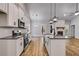 Modern kitchen featuring granite countertops, stainless appliances, and white cabinetry at 48 Paschal St, Temple, GA 30179