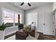 Well-lit office space with ample natural light, neutral paint and wood-look flooring at 48 Paschal St, Temple, GA 30179