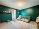 Charming Bedroom with gold crib, green walls and accent shelving at 4812 Shallow Creek Nw Dr, Kennesaw, GA 30144