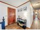 Inviting entryway with wood-look floors, table decor, and paneled front door at 4812 Shallow Creek Nw Dr, Kennesaw, GA 30144