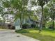 Charming home with a two-car garage, lush green lawn, and mature trees providing shade and curb appeal at 4812 Shallow Creek Nw Dr, Kennesaw, GA 30144