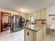 Well-equipped kitchen with stainless steel appliances, granite countertops, and tile flooring at 4812 Shallow Creek Nw Dr, Kennesaw, GA 30144
