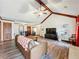 Spacious living room features vaulted ceilings, exposed beams, and stylish decor at 4812 Shallow Creek Nw Dr, Kennesaw, GA 30144