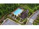 Aerial view of a community pool with cabanas and lounge chairs surrounded by lush green landscaping at 6445 Lucent Ln, Atlanta, GA 30328
