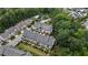 Aerial view of a townhome community, nestled among lush trees and landscaping at 6445 Lucent Ln, Atlanta, GA 30328