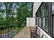 Relaxing outdoor balcony offers a serene view of the surrounding lush greenery at 6445 Lucent Ln, Atlanta, GA 30328