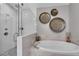 Modern bathroom features a glass shower, soaking tub, and decorative wall art at 6445 Lucent Ln, Atlanta, GA 30328