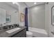 Modern bathroom features shower over tub, large vanity, and contemporary fixtures at 6445 Lucent Ln, Atlanta, GA 30328