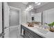 Bathroom featuring double sinks, modern vanity with white countertops and tiled floors at 6445 Lucent Ln, Atlanta, GA 30328